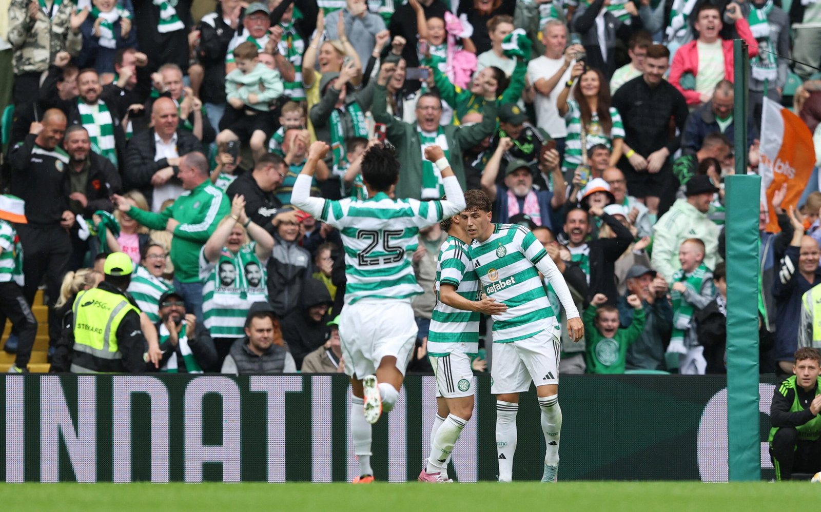 Celtic's Arne Engels celebrates scoring their first goal with teammates
