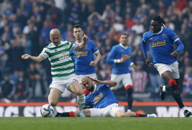 Daizen Maeda wins the ball for Celtic against Rangers.