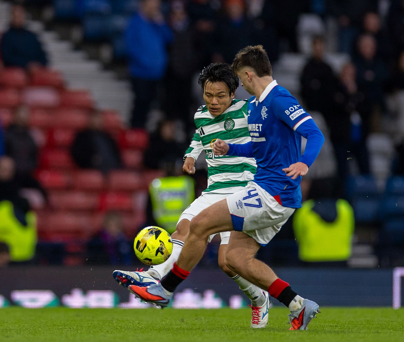 Celtic f.c. Reo Hatate tackles Rangers player